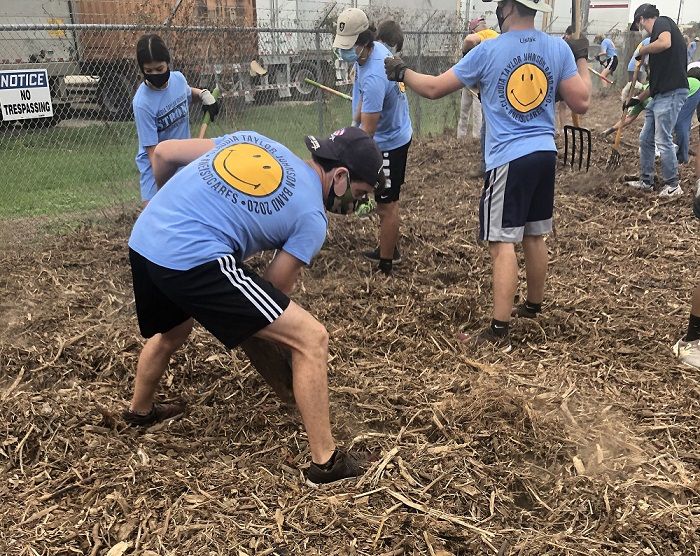 Claudia Taylor Johnson band members doing community work