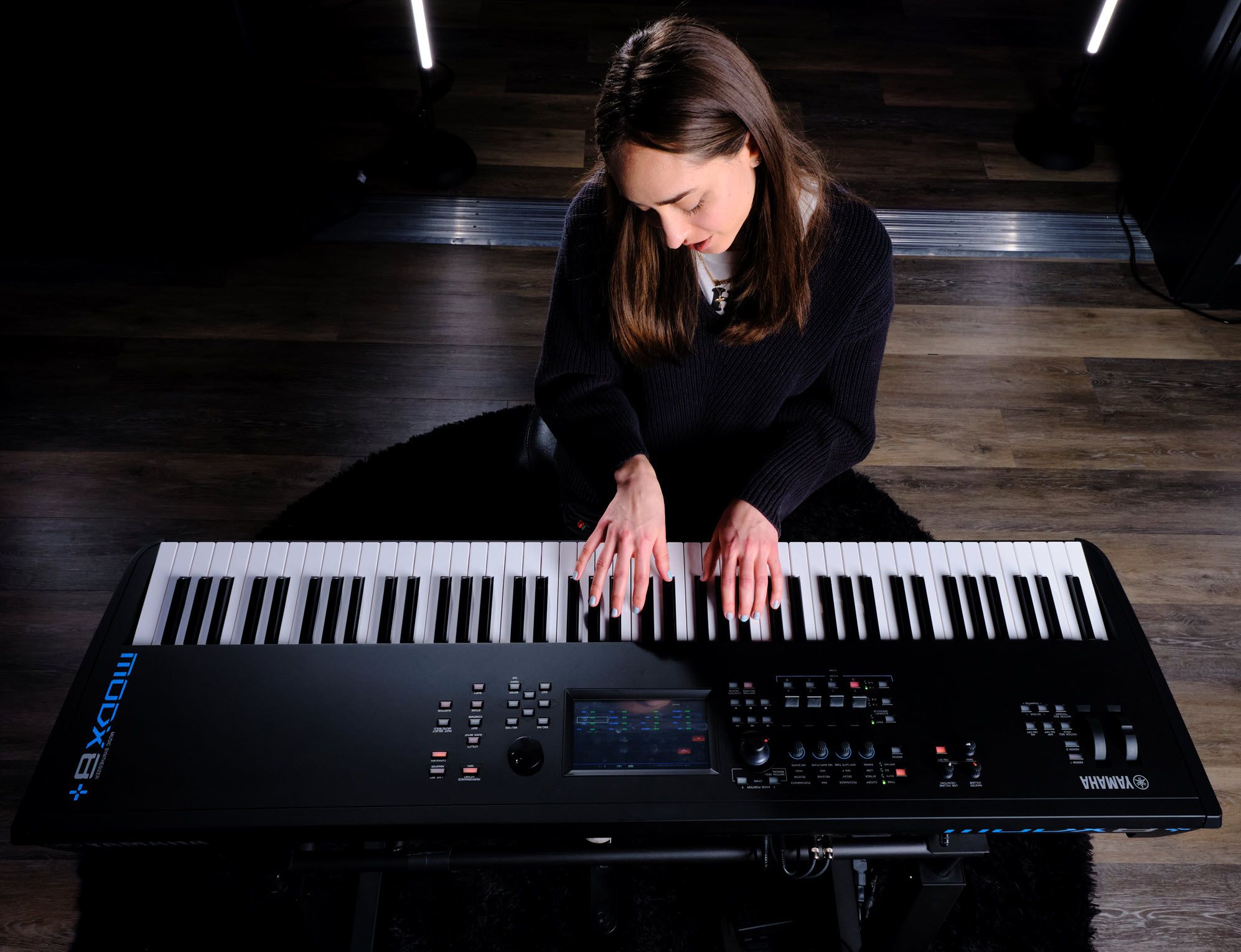 Woman playing synthesizer