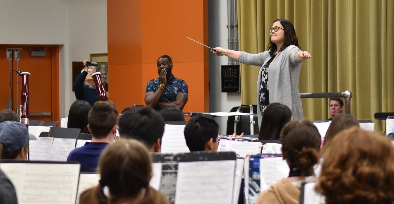 Liz Love conducting class while composer Omar Thomas listens