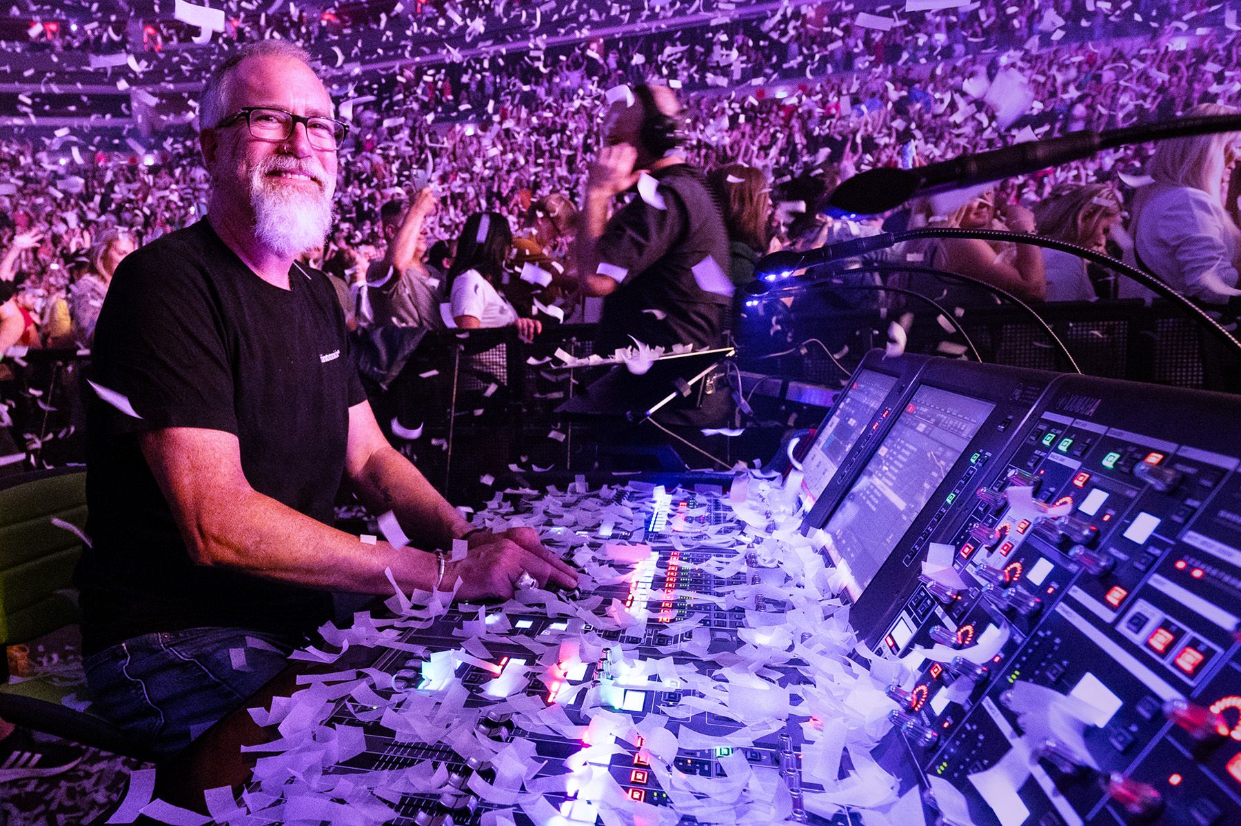 man using audio mixer with confetti falling down