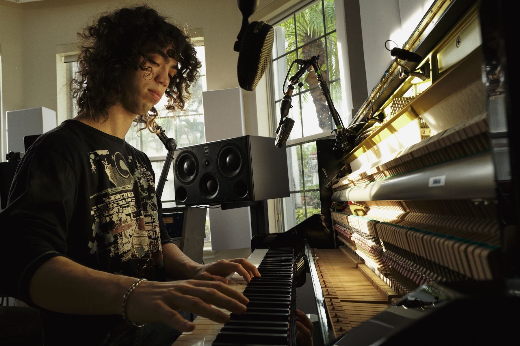 man playing piano in room