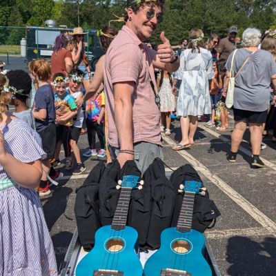 2026 Yamaha "40 Under 40" educator Ben Byrom pulling cart with mandoleles