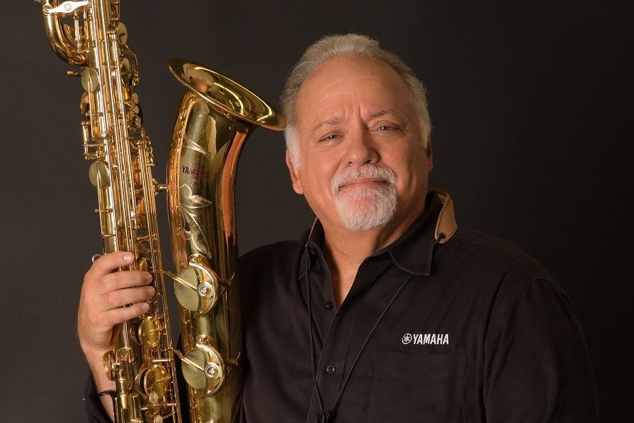 Denis DiBlasio holding bari sax