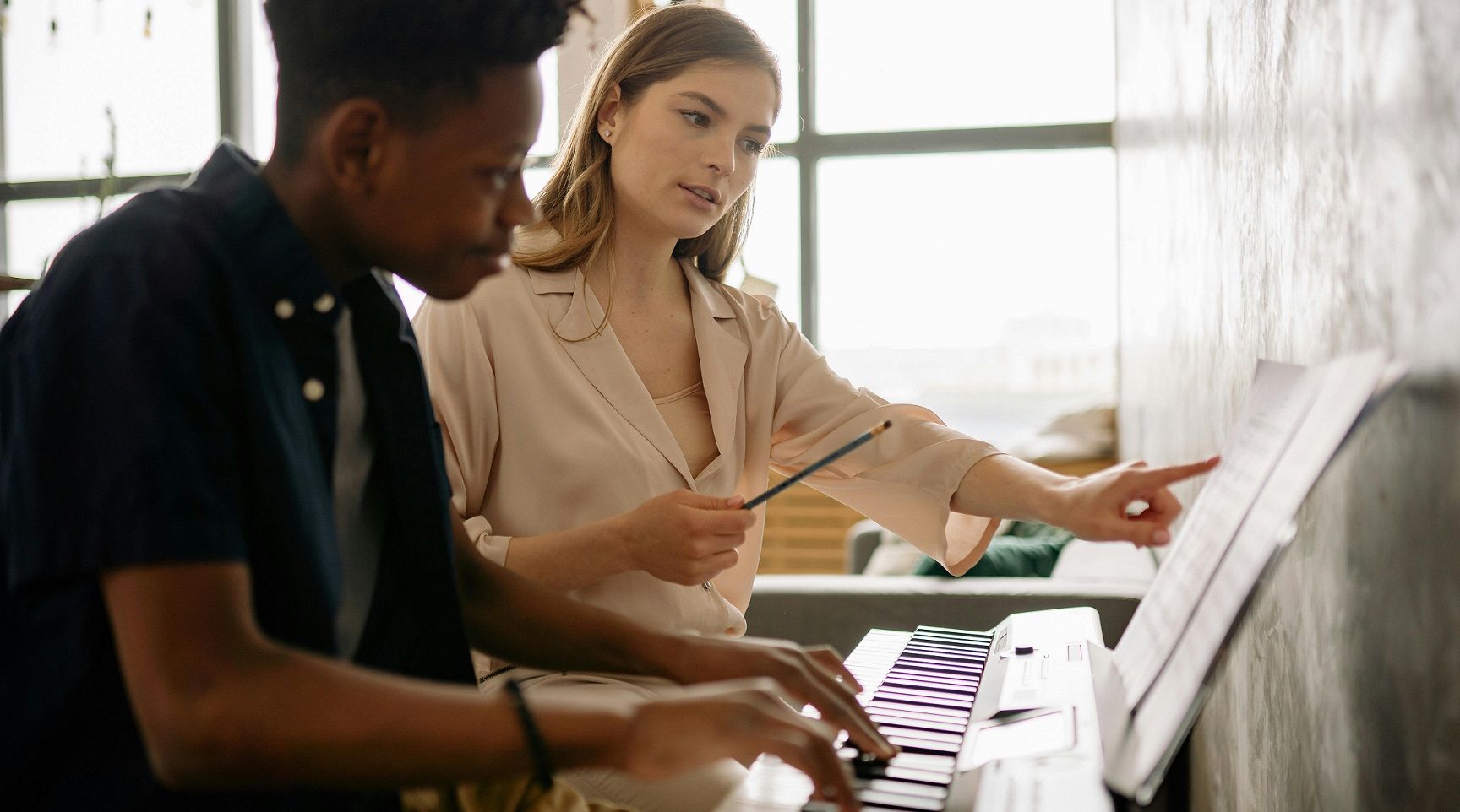 piano teacher and student