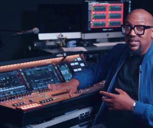 man in front of audio mixer