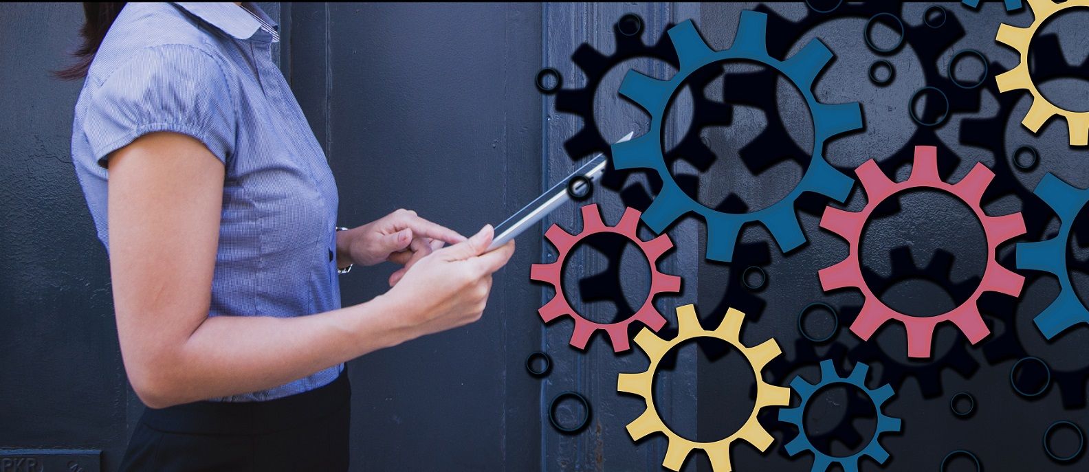 woman holding tablet with interconnected cogs behind her
