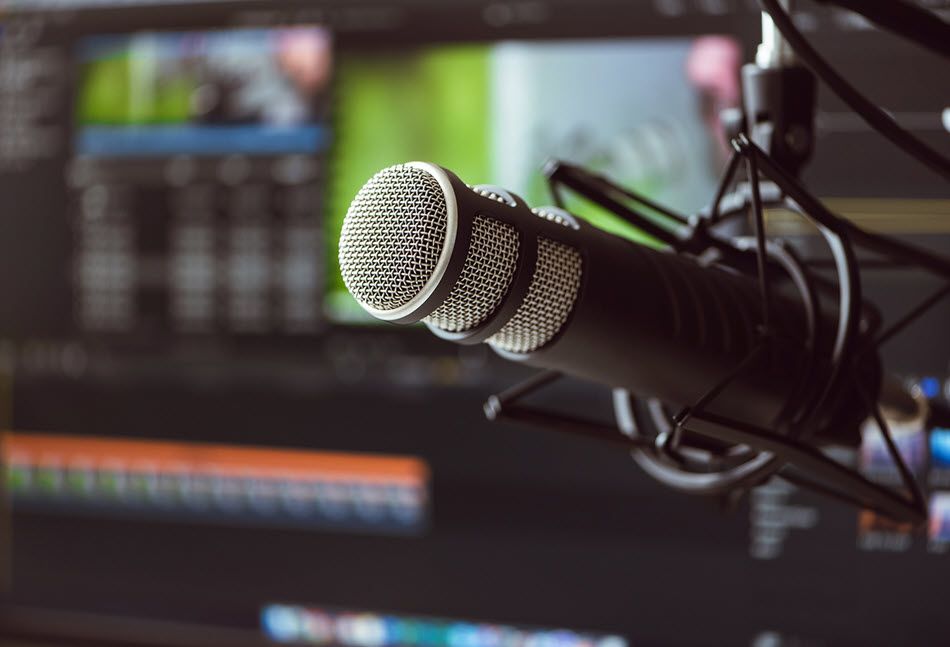 Closeup of a microphone in a studio.