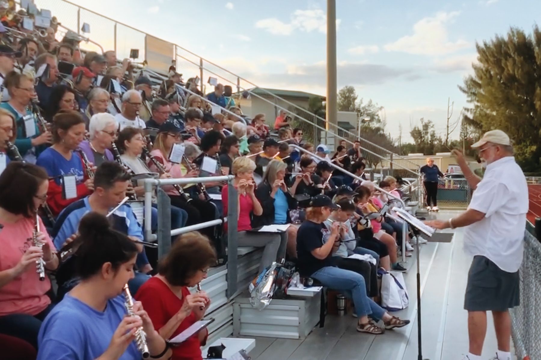 Band director leading group outside