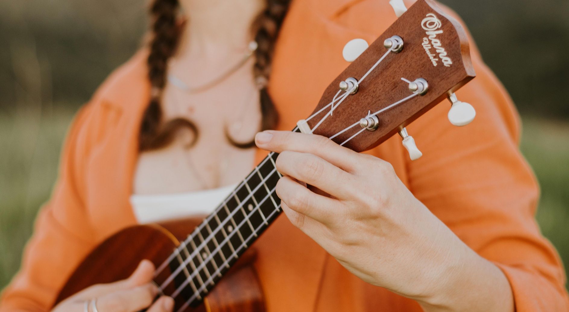 closeup of female playing ukulele