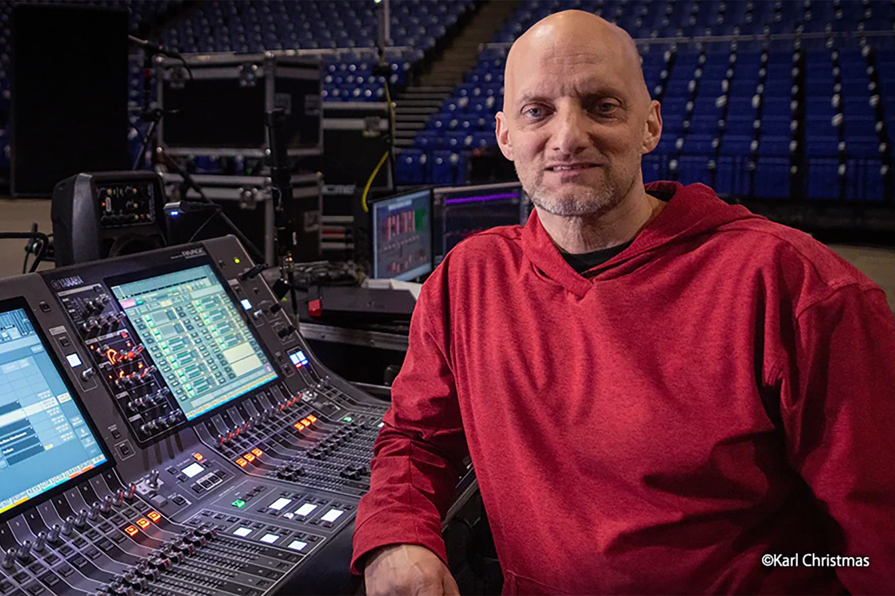 man in front of audio mixer