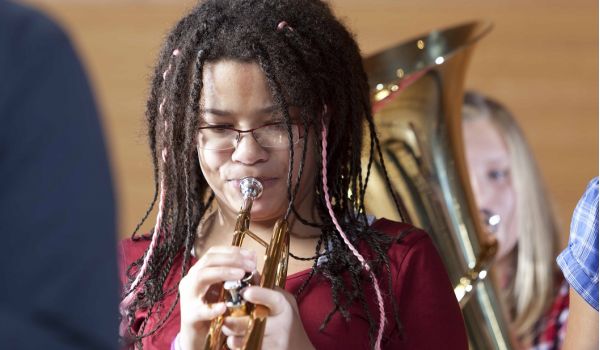 female student playing the trumpet 