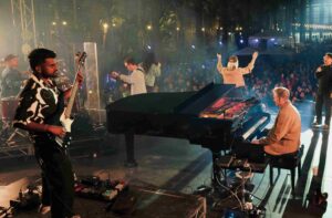 A band playing on a large stage.