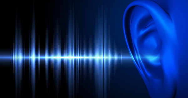 Graphic showing sound waves entering a person's ear.
