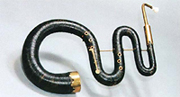 An image of an early precursor to a tuba. It is a long, snake-like instrument which appears to be ornately gilded.
