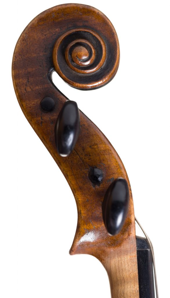 Scrolled wood handle of a violin.