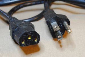 Closeup of the male and female ends of the IEC cable.