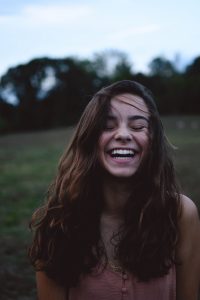 young female laughing