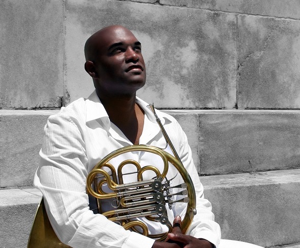 Larry Williams holding French horn