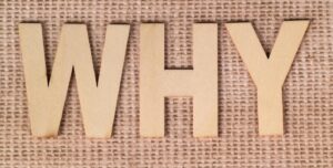 wooden letters spelling the word "why"
