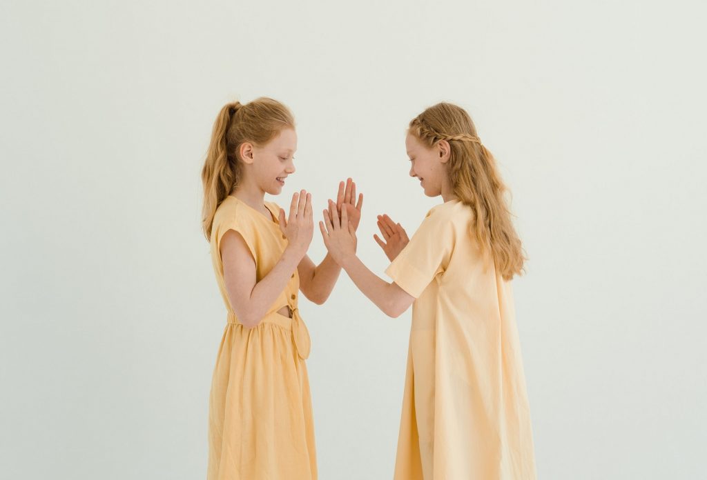 two girls playing clapping game