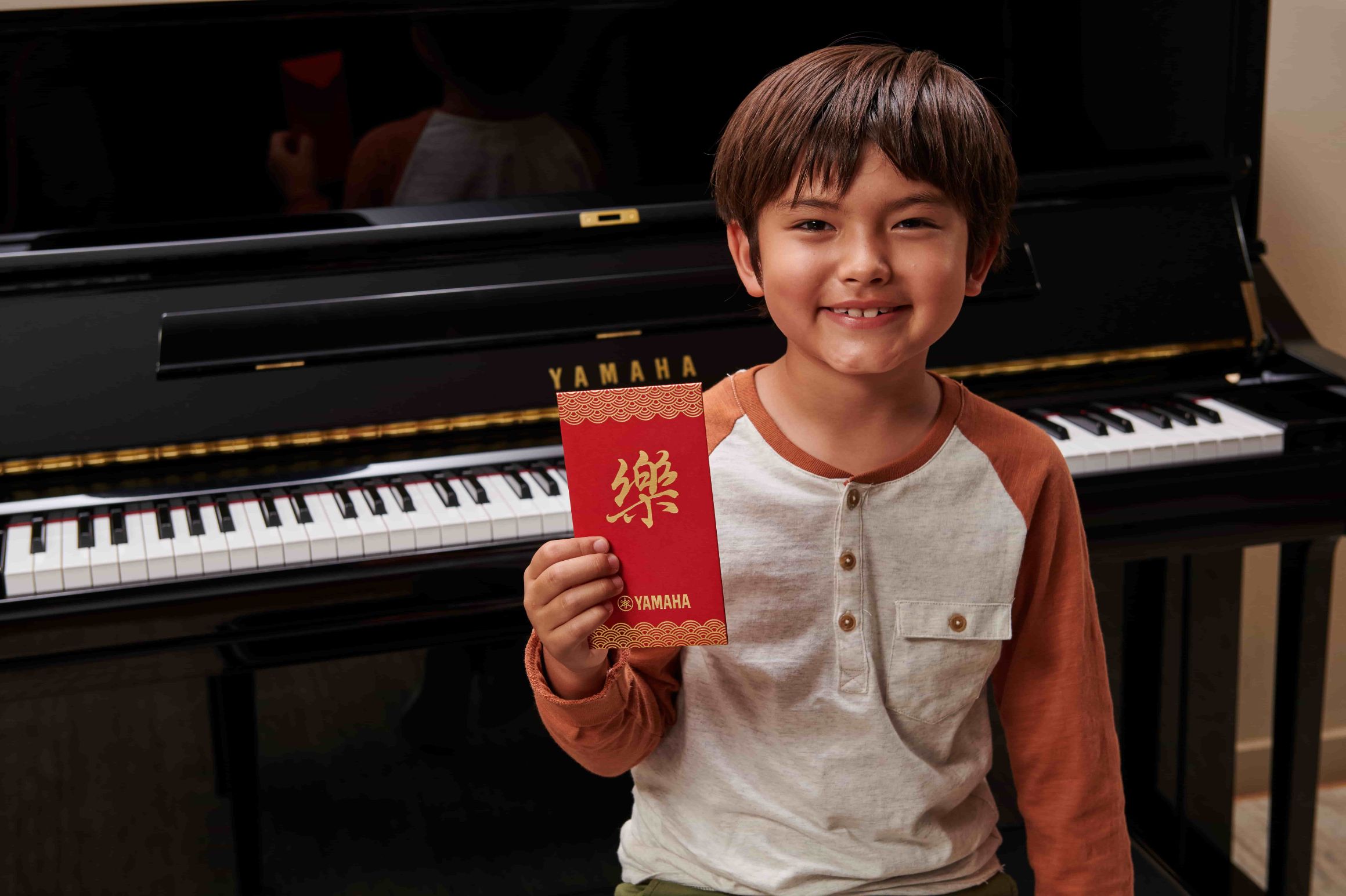 Boy with Yamaha piano