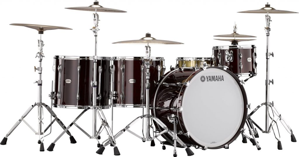 Classic full drum kit with high hats and bass drum. The name Yamaha appears on drum face.