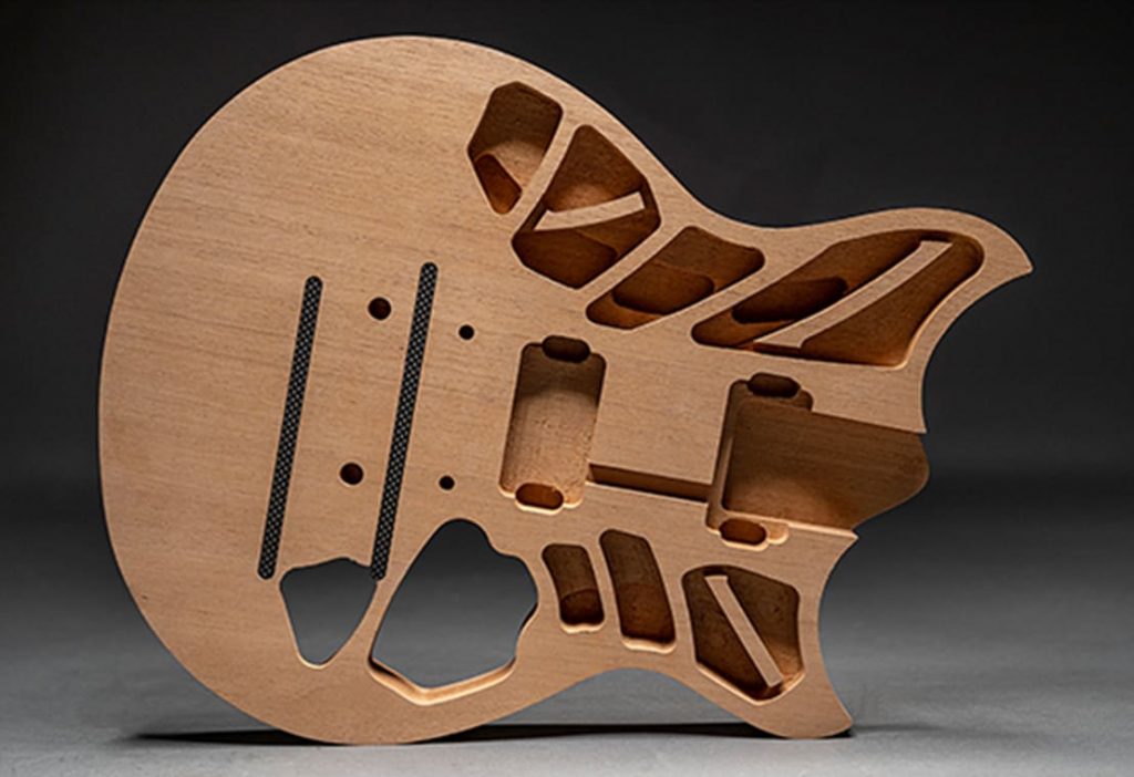 Wood body of an electric guitar with the inner construction (without the electrical elements) visible.