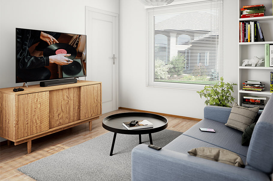 Modern living room with TV showing movie with a focus on someone using a turntable.