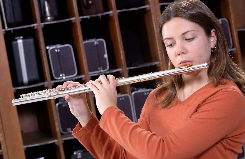 female student playing flute
