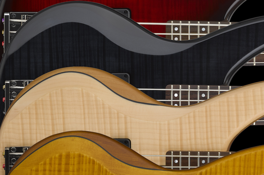 Closeup of a set of bass guitar bodies.