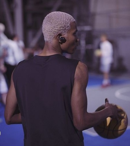 View of someone working out with an earbud in right ear.