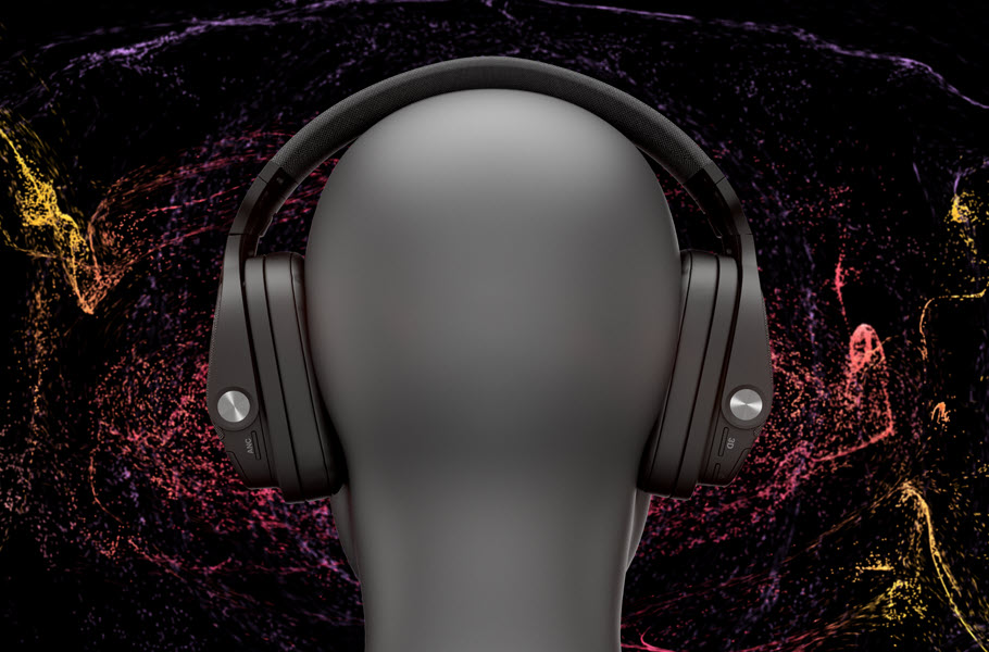 View of a mannequin head wearing over the headphones as seen from behind.