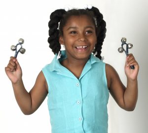 elementary school girl holding bells