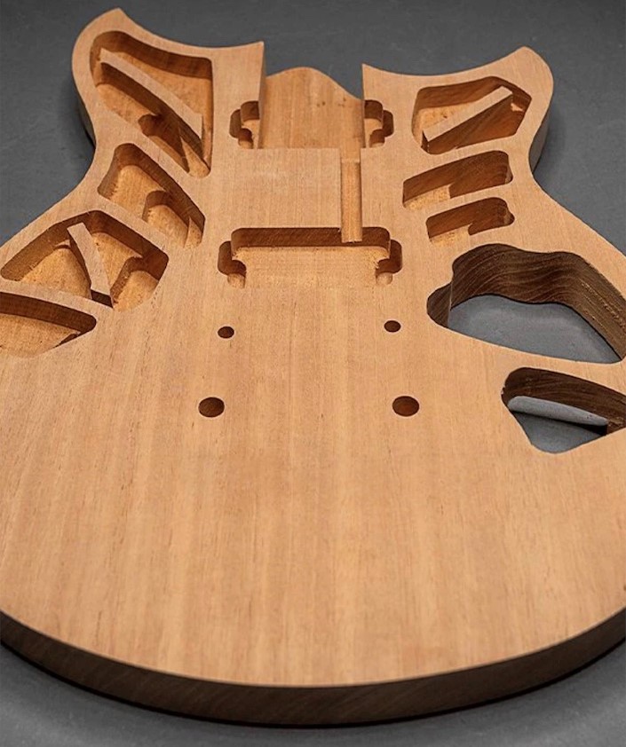 View of unfinished body of a guitar.