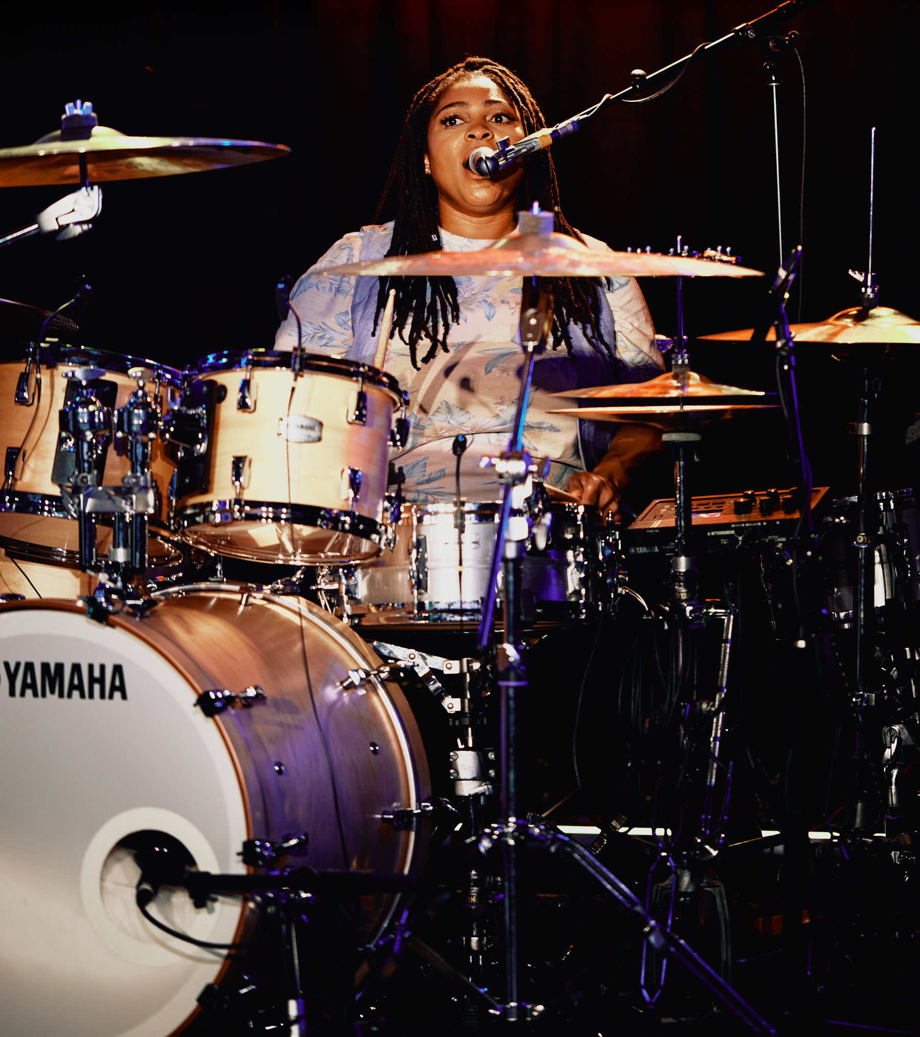 Woman playing drums.