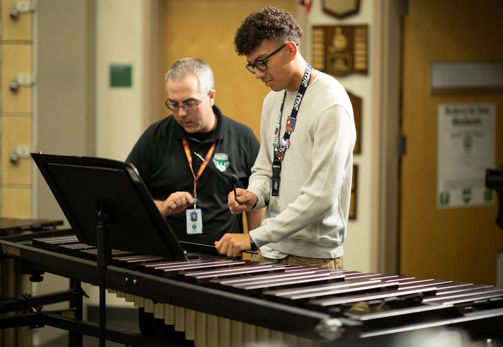percussion teacher with male student