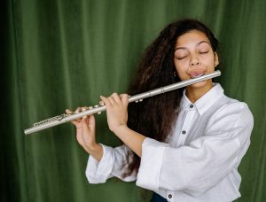 female student playing the flute