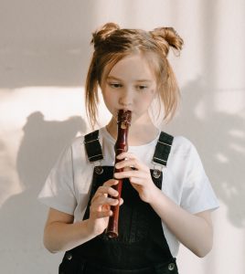 girl playing recorder