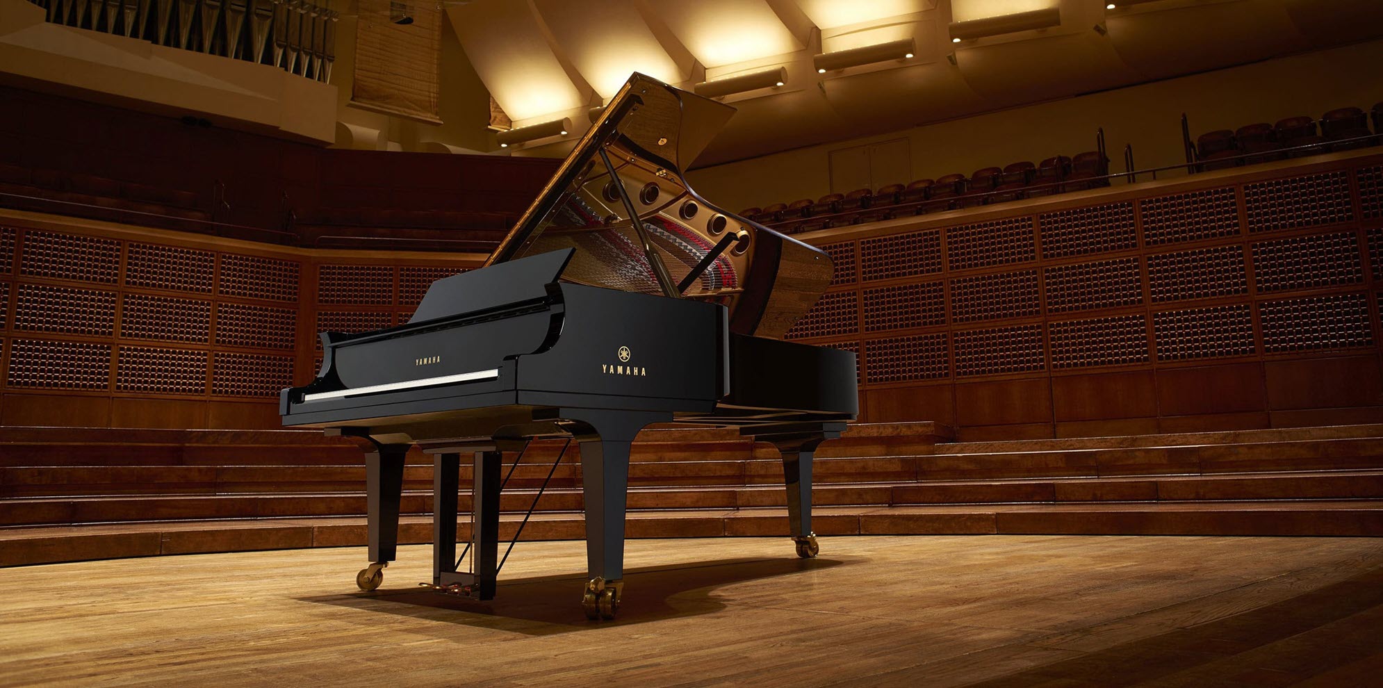 Grand piano on concert stage.