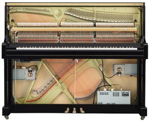 The insides of an upright piano.