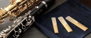 A saxophone, a clarinet and three reeds.