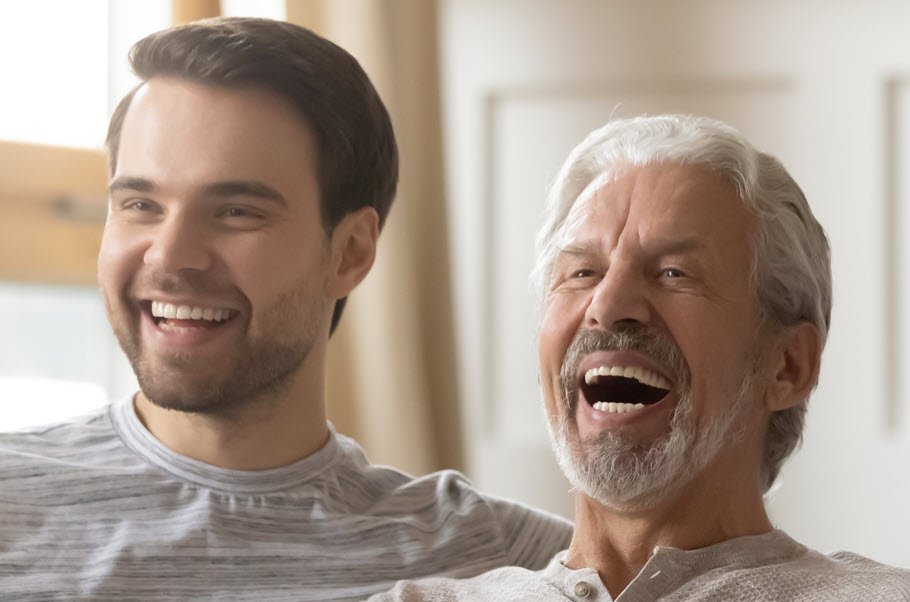 Father and son laughing.