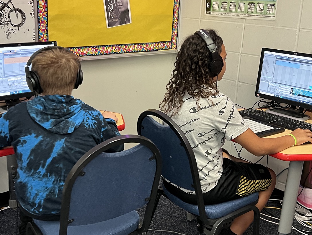 two students working at DAWs