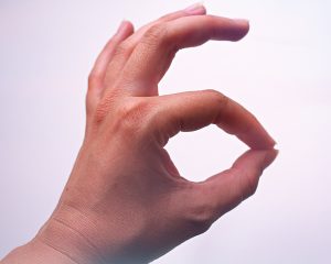 OK finger gesture -- thumb and index finger touching to form a circle