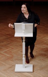 teacher standing at podium
