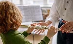 student playing flute