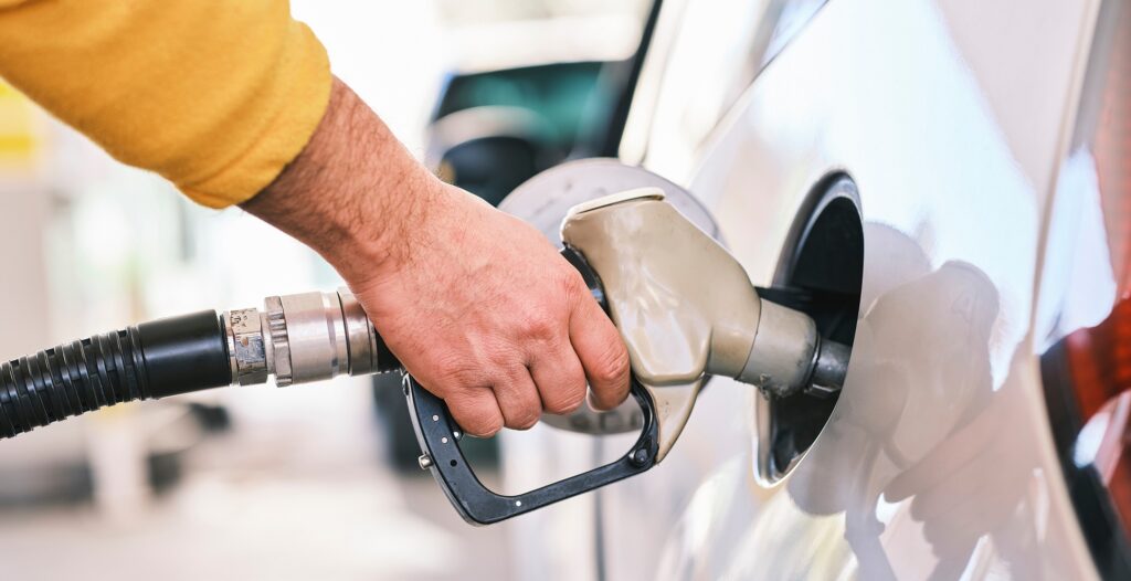 close up of someone putting gas in their car