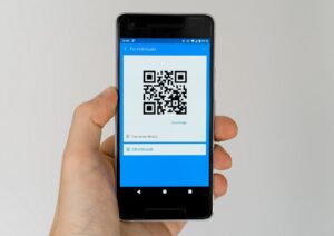 mobile phone with QR code on screen