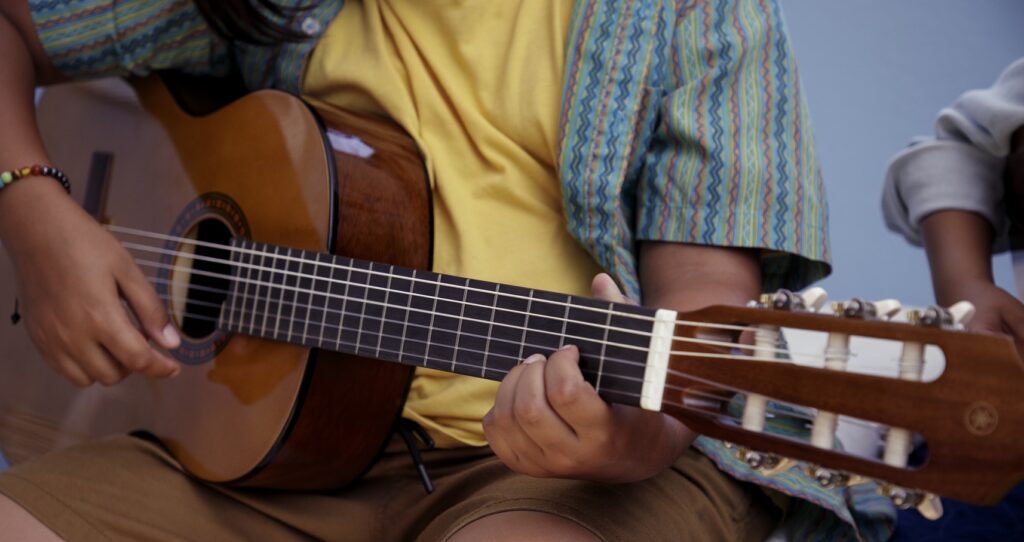 close-up of someone playing the guitar