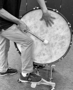 use knee to dampen bass drum